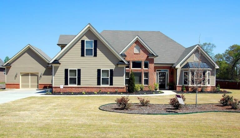 large house with brick and vinyl siding